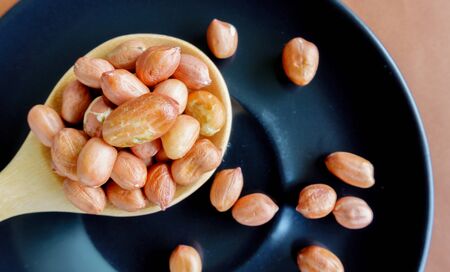 Peanuts put on plate on the table.の写真素材