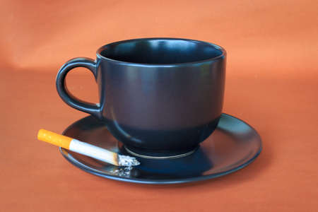 cup coffee of cigarette  on table,の写真素材