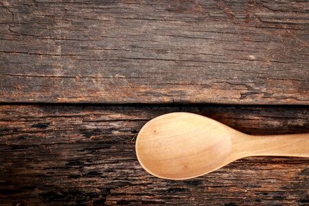 Empty wooden spoon put on wooden tableの写真素材