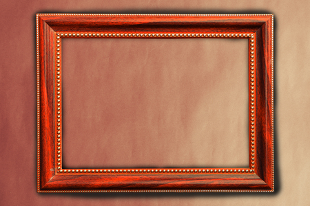 Vintage picture frame on brown wall backgroundの写真素材