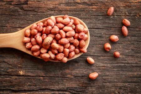 Peanuts on wooden table.の写真素材