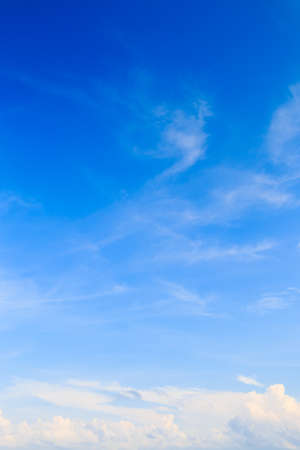 Blue sky with tiny cloudsの写真素材