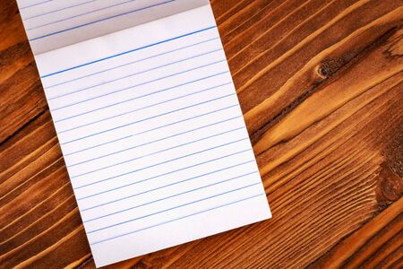 Blank paper on old wooden wall background for put your text.