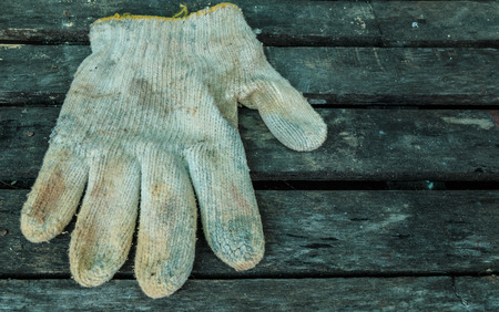 Construction gloves on wooden