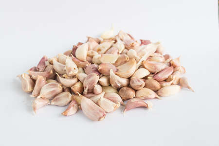 garlic cloves on white backgroundの写真素材