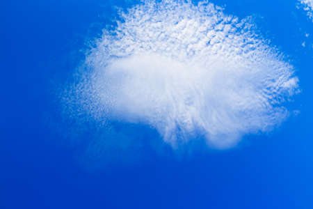 Blue sky with tiny cloudsの写真素材