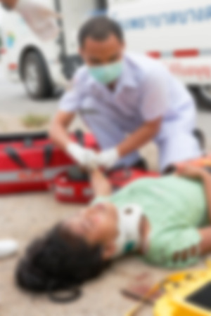 Blurred image of unidentified accident people by car waiting medicine or doctor at the site of accident.の写真素材