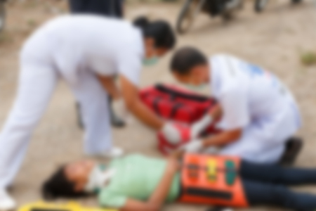 Blurred image of unidentified accident people by car waiting medicine or doctor at the site of accident.の写真素材