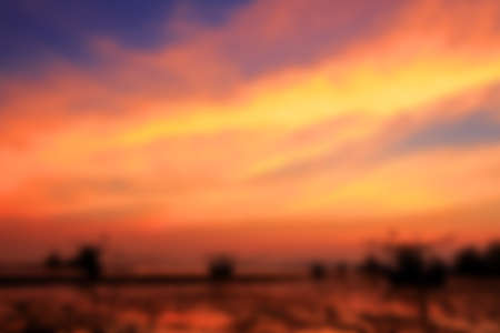 Blurred image of colorful sunset on the beach background.の写真素材