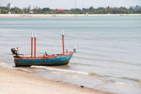 Fishing boat on the sea with sand in Thailandの写真素材