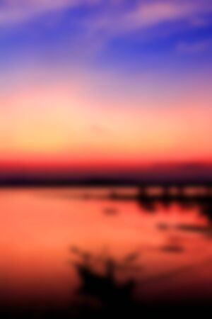 Blurred image of colorful sunset on the beach background.の写真素材