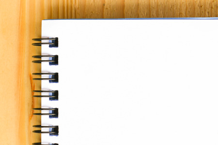 Blank paper on wooden table backgroundの写真素材