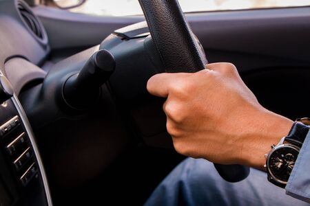 business man control and sit in carの写真素材