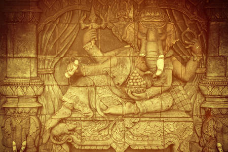 Elephant god statue on public temple wall in Thailandの写真素材