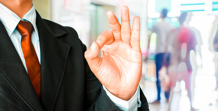 Businessman hand showing sign OKの写真素材