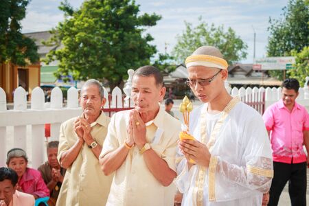 SONGKLA,THAILAND JULY 7 : Male will be ordained Buddhist walk to the temple. Thailand on July 7, 2014のeditorial素材