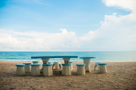 beach chair on beach with blue skyの写真素材