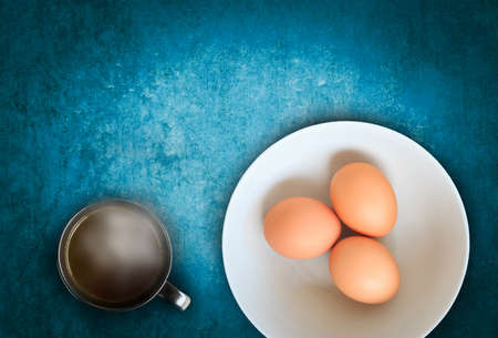 raw eggs with hot chocolate on wooden background, wooden with blank space for insert your texts or products.の写真素材