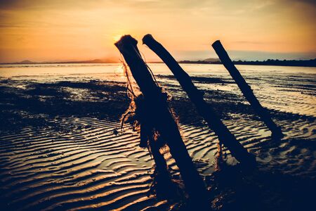 Landscape of sunset background on the beach with vintage filter style.の写真素材