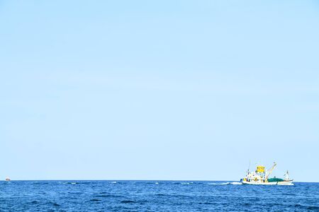 Abstract blurred of boat at the sea with blue sky backgroundの写真素材