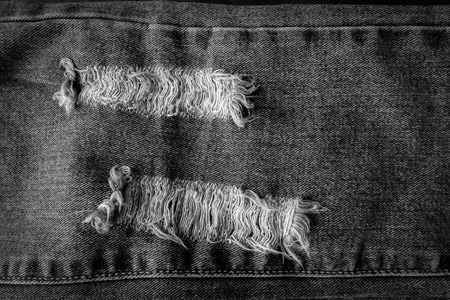 Old vintage denim torn texture backgroundの写真素材