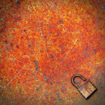 Close up metal texture background with rustic key lock