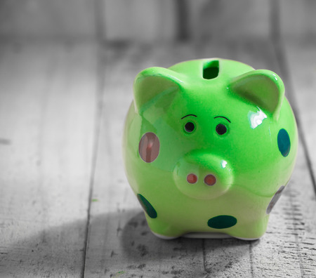 piggy bank on wooden tabletopの写真素材