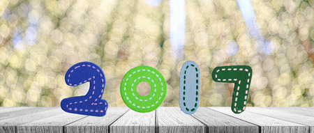 New years 2017 sign on bokeh light backgroundの写真素材