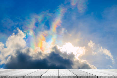 Empty top of wooden table and view of sunset or sunrise backgroundの写真素材