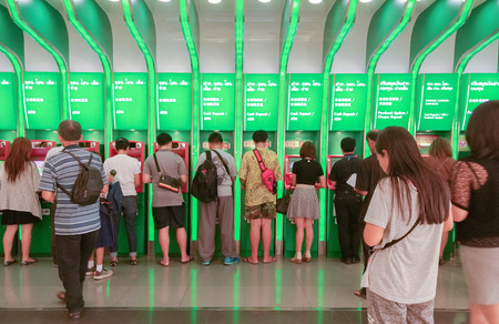 BANGKOK, THAILAND - JUNE 21, 2017: Unidentified people queuing to withdraw cash in ATM machine. Queue to use ATM is really dense for the beginning of each month.のeditorial素材