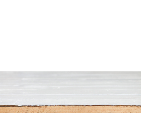 Old grunge wooden tabletop with white space background use for product displayの写真素材