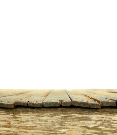 Old grunge wooden tabletop with white space background use for product displayの写真素材