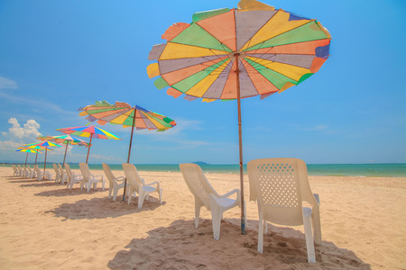 Beach chair and umbrella on sand beachの写真素材