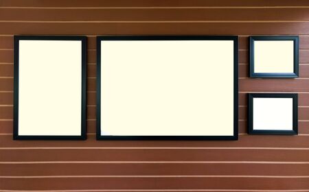 Blank white picture frame on wooden wall background use for show your picture