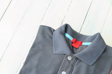 Man shirts put on white wooden table top backgroundの写真素材