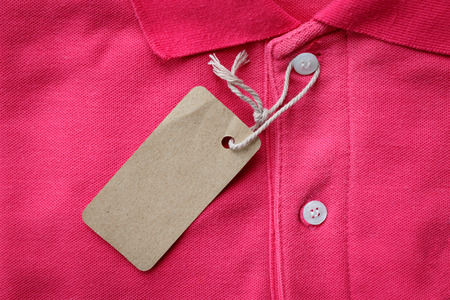 Close up top view of man polo shirt put on rustic wooden table top with blank space use for texts...