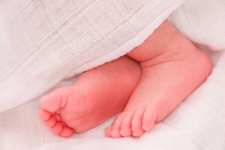 Close up baby feet sleeping in the bed