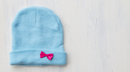 Close up infant baby cap put on wooden table topの写真素材