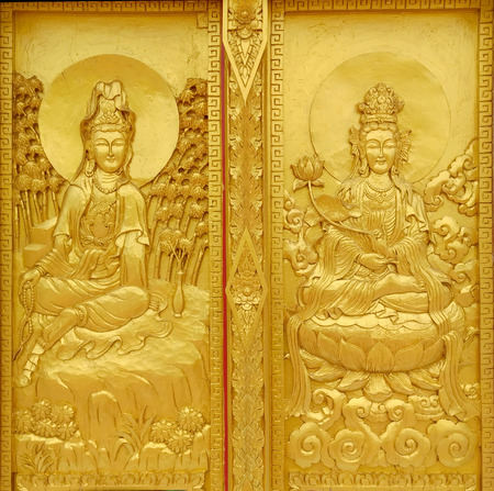 Craft of Guan Yin Chinese god at the temple door in Thailand