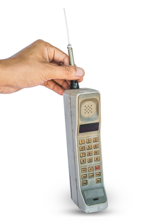 Close up rustic vintage mobile phone isolated on white backgroundの写真素材