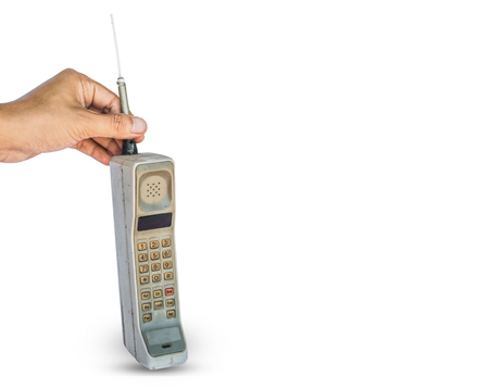 Close up rustic vintage mobile phone isolated on white backgroundの写真素材