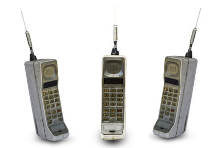 Close up rustic vintage mobile phone isolated on white backgroundの写真素材