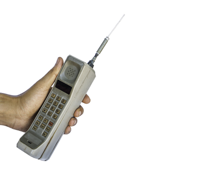 Close up rustic vintage mobile phone isolated on white backgroundの写真素材