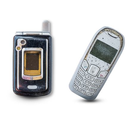 Close up rustic vintage mobile phone isolated on white backgroundの写真素材