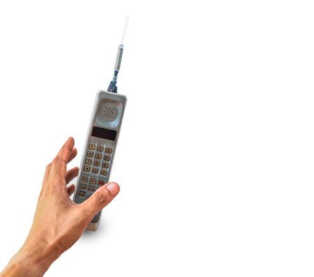 Close up rustic vintage mobile phone isolated on white backgroundの写真素材