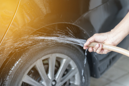 Human hand showing clean up and wash the carの写真素材