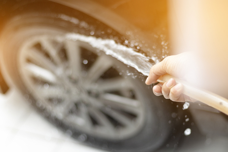 Human hand showing clean up and wash the carの写真素材