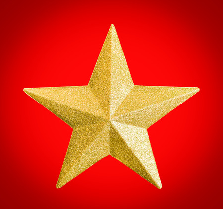 Close up golden star icon with glittery isolated on white backgroundの写真素材