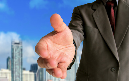 Close up businessman showing gesture handshakeの写真素材