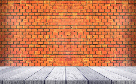 Wooden shelves with old rustic brick wall background interiorの写真素材